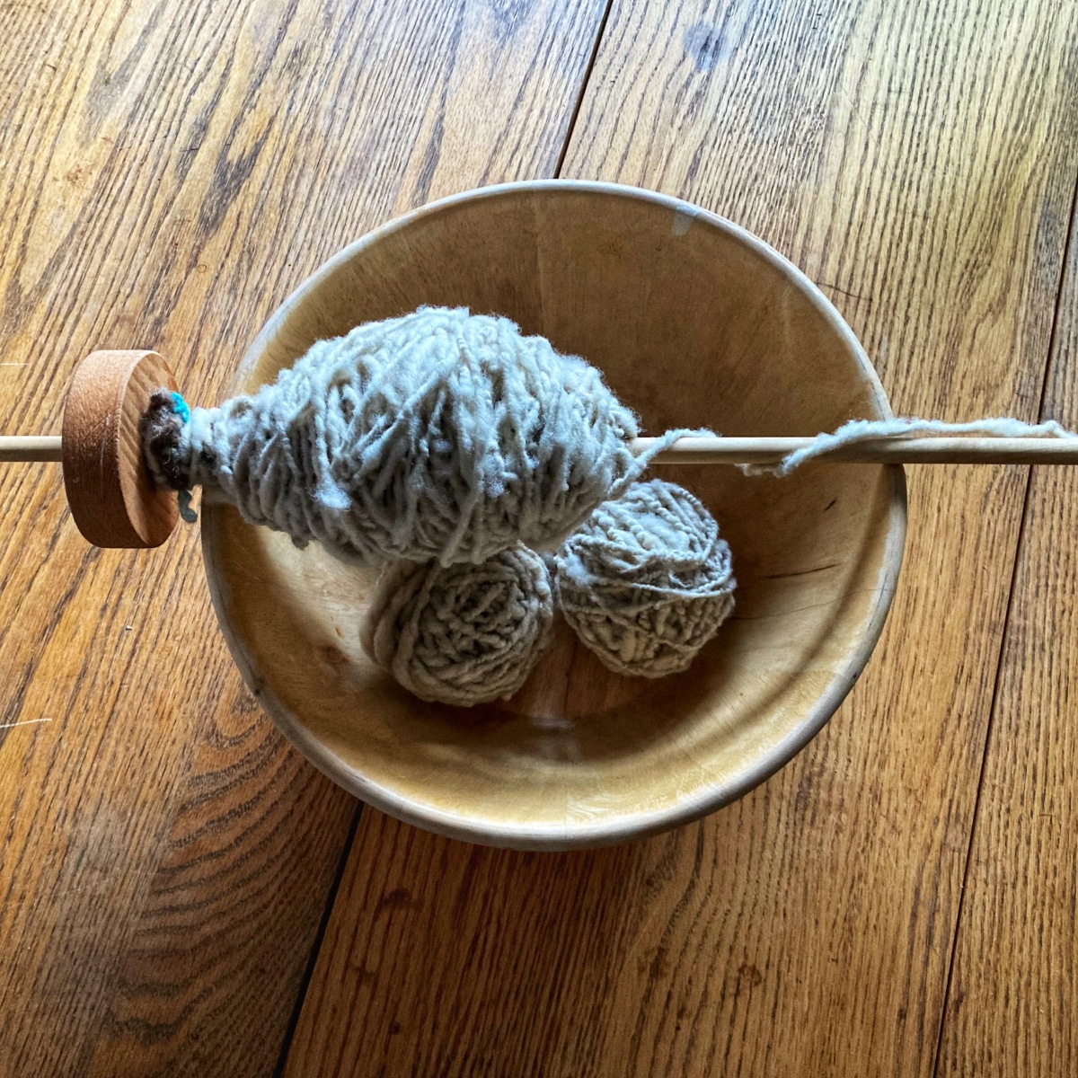 Spinning wool by hand